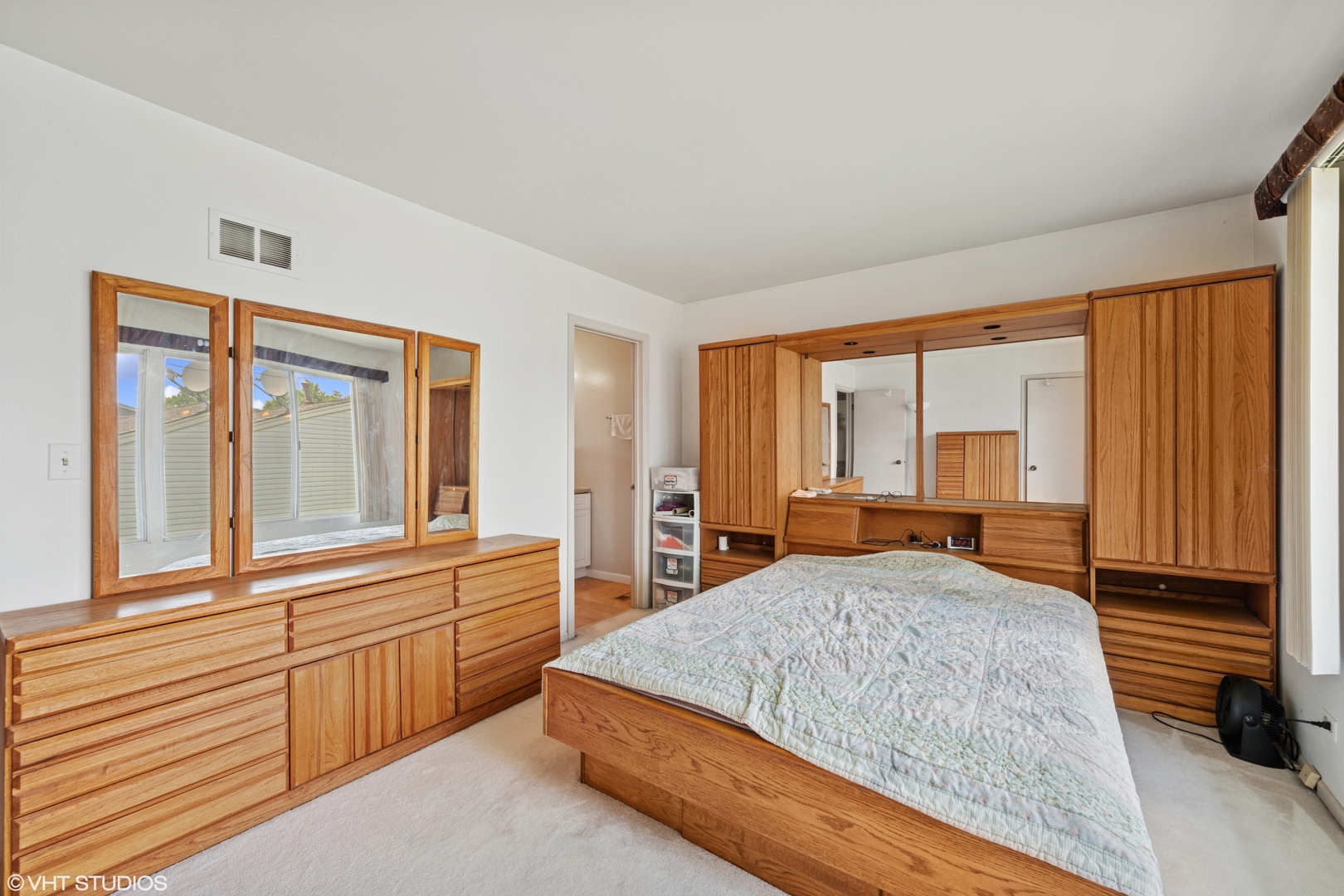 795 Hunter Drive Roselle, IL 60172 - Photo 11 of 26 a large bedroom with a large bed and large windows