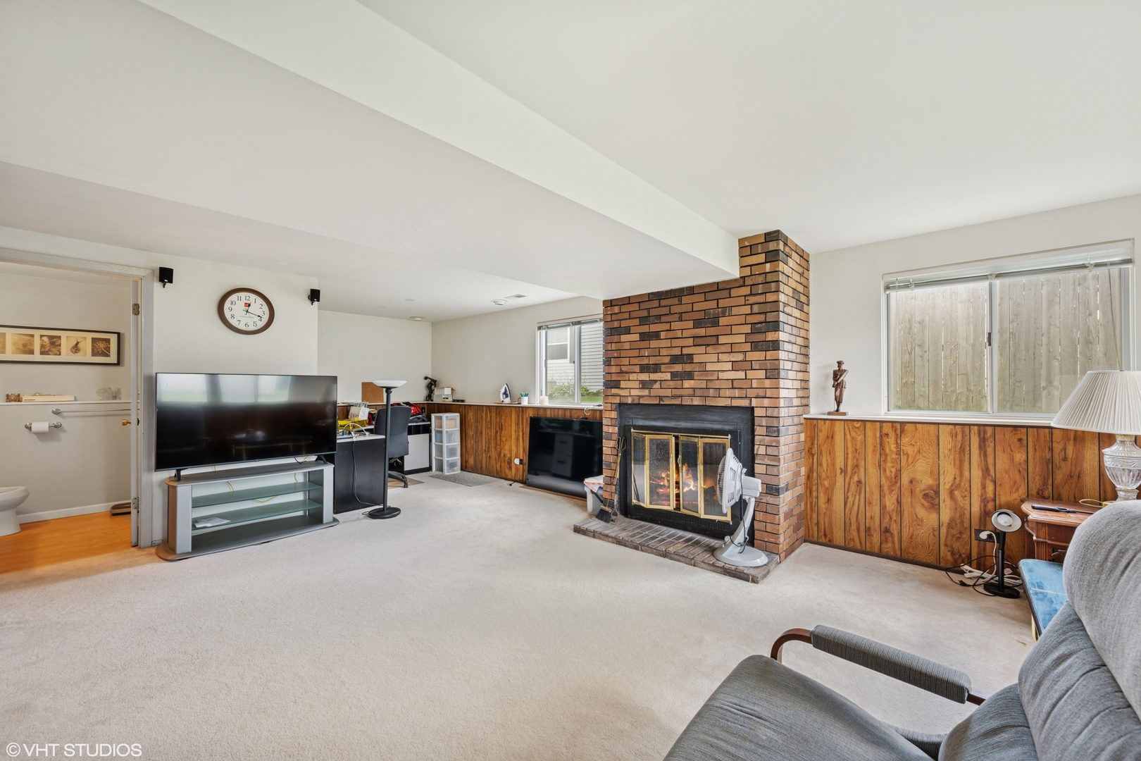 795 Hunter Drive Roselle, IL 60172 - Photo 19 of 26 a living room with furniture and a fireplace