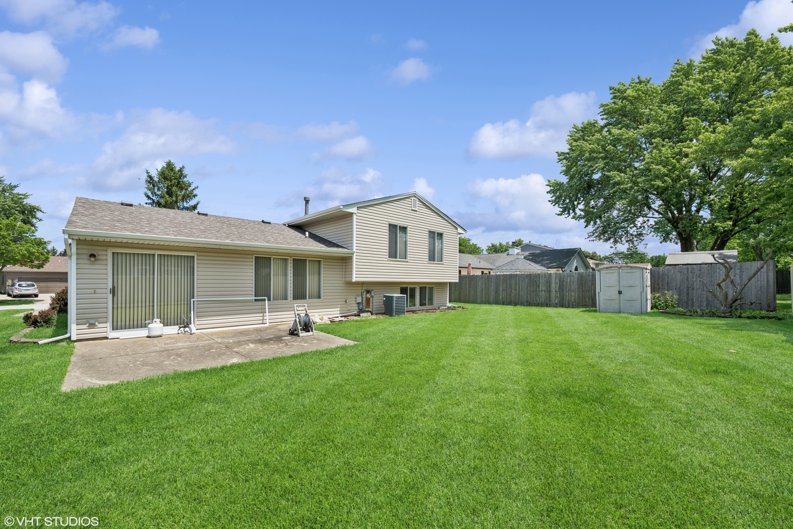 795 Hunter Drive Roselle, IL 60172 - Photo 21 of 26 a front view of house with a garden and patio