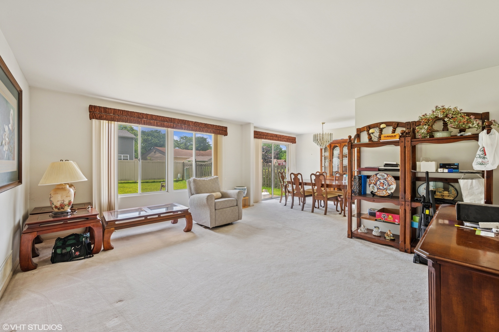795 Hunter Drive Roselle, IL 60172 - Photo 3 of 26 a living room with furniture and a flat screen tv
