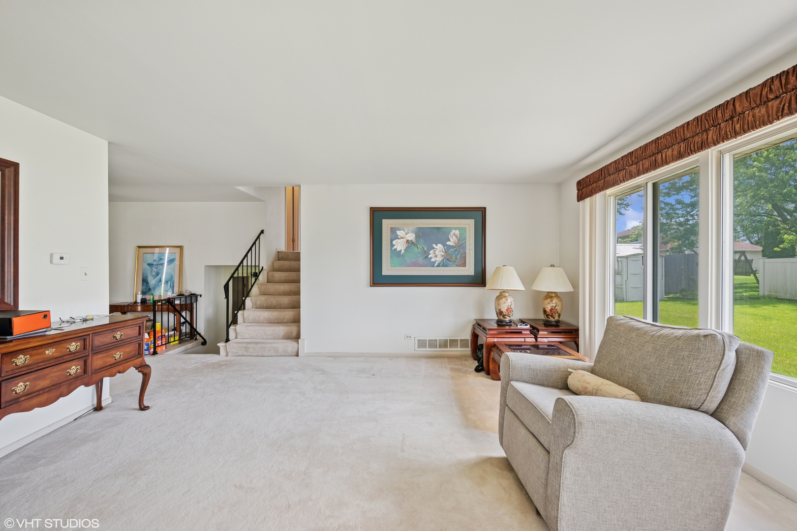 795 Hunter Drive Roselle, IL 60172 - Photo 4 of 26 a living room with furniture and a large window
