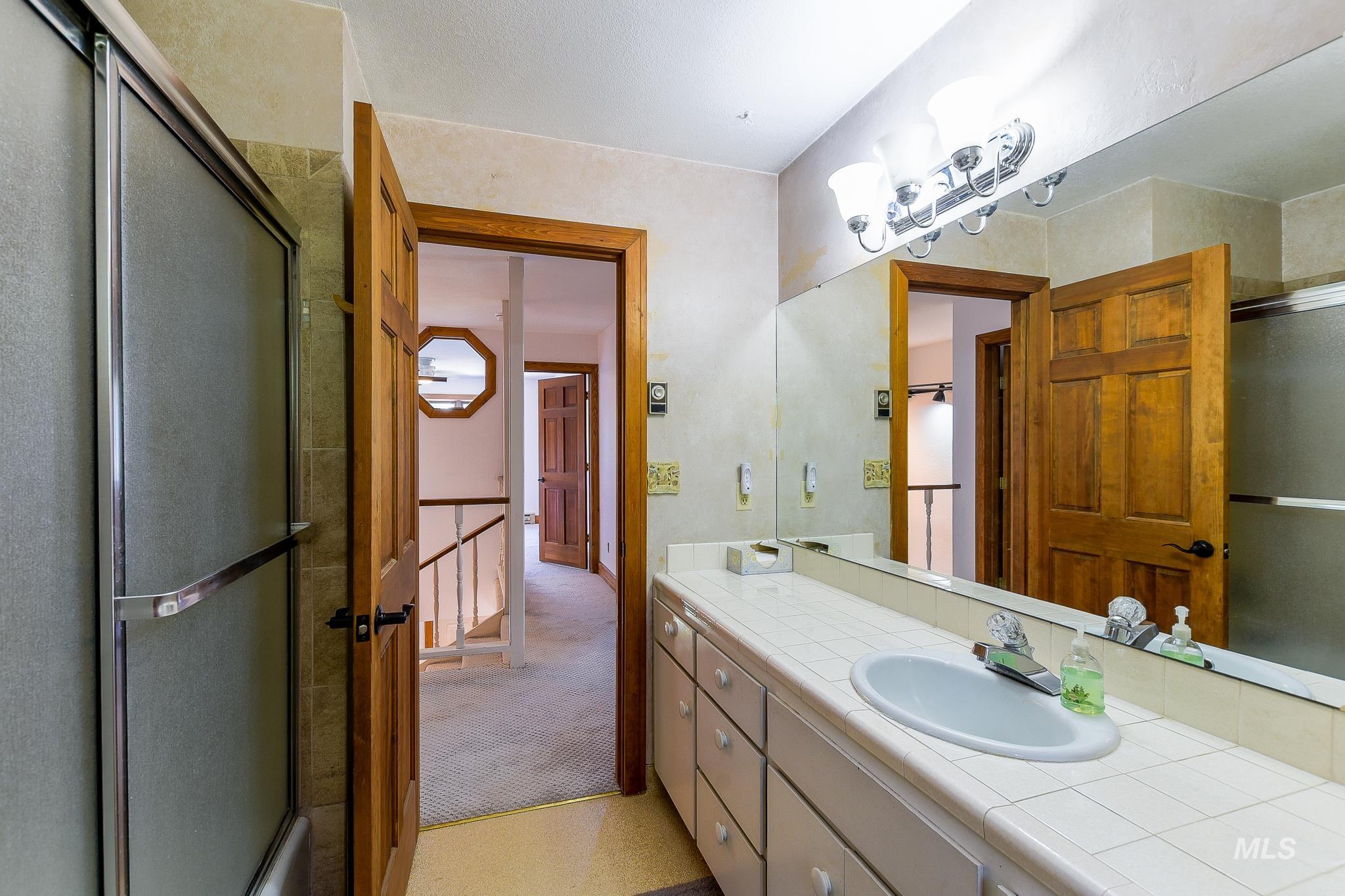 1045 Joyce Road Moscow, ID 83843 - Photo 26 of 50 White tile vanity with integrated sink