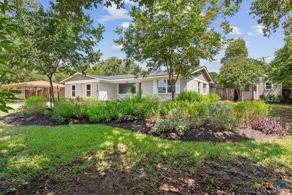 a house view with a garden space