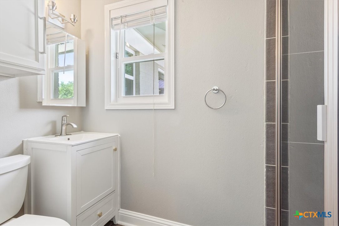 2810 Lilac Lane Temple, TX 76502 - Photo 18 of 40 a bathroom with a sink toilet and window