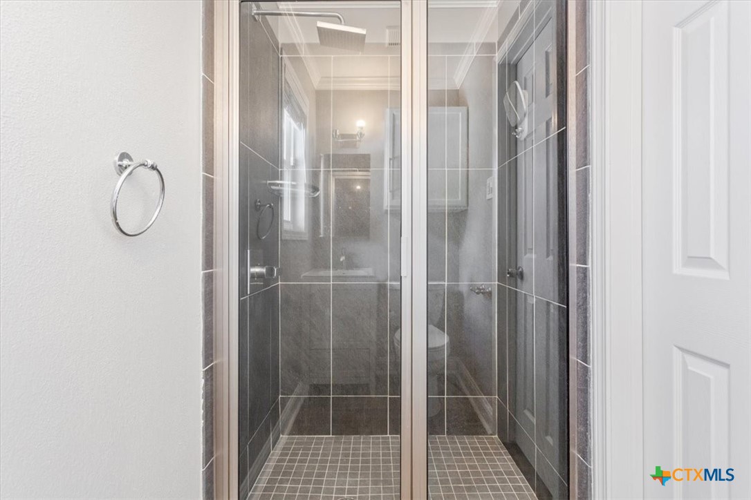 2810 Lilac Lane Temple, TX 76502 - Photo 19 of 40 a bathroom with a glass shower door