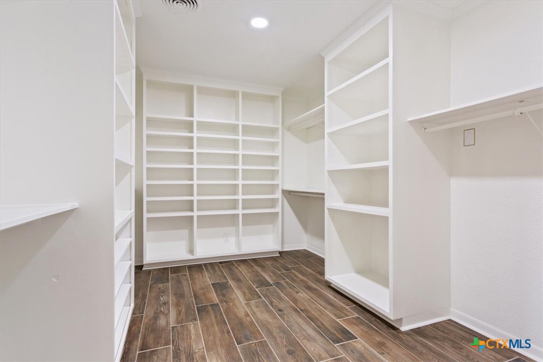 2810 Lilac Lane Temple, TX 76502 - Photo 20 of 40 a view of an empty room with wooden floor and a window