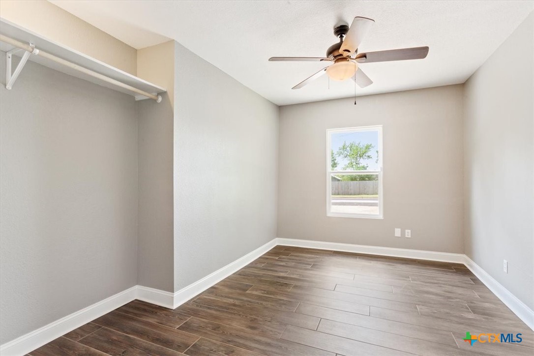 2810 Lilac Lane Temple, TX 76502 - Photo 25 of 40 wooden floor in an empty room with a window