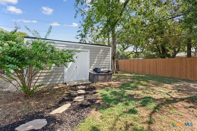 a view of a house with a garden