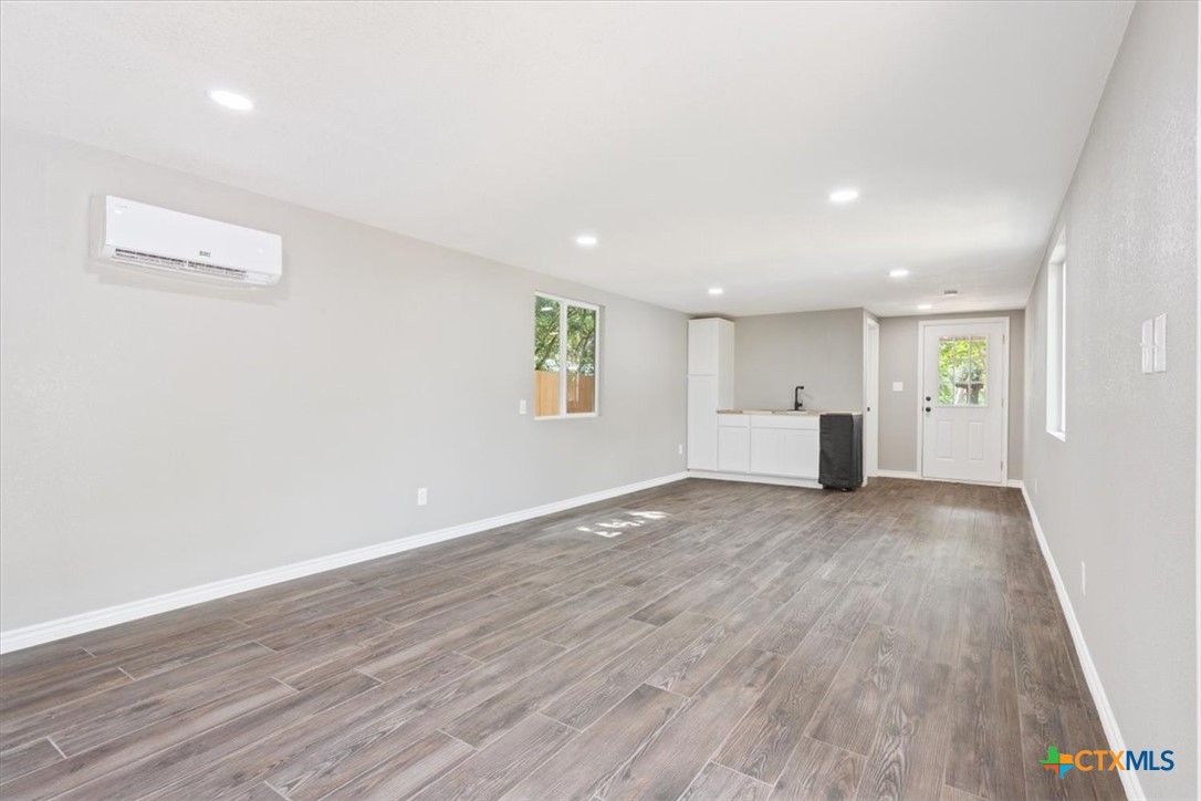 2810 Lilac Lane Temple, TX 76502 - Photo 37 of 40 a view of empty room with wooden floor and window