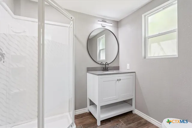 a view of a backyard with a tree