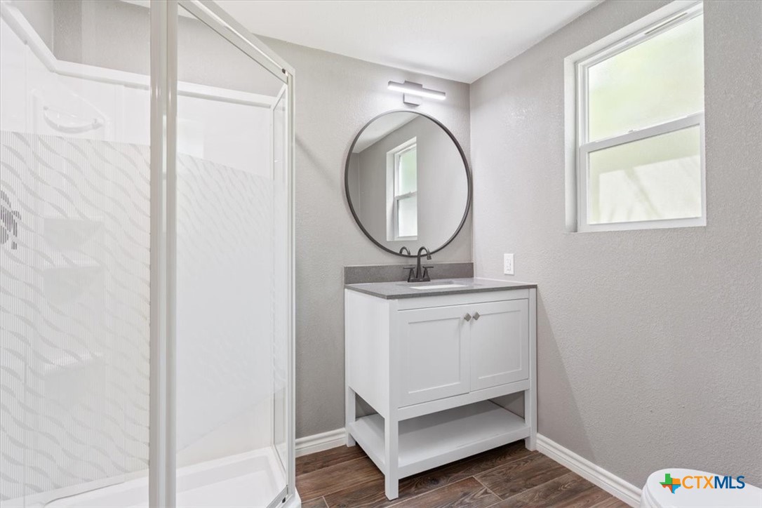 2810 Lilac Lane Temple, TX 76502 - Photo 39 of 40 a bathroom with a sink a mirror and a vanity