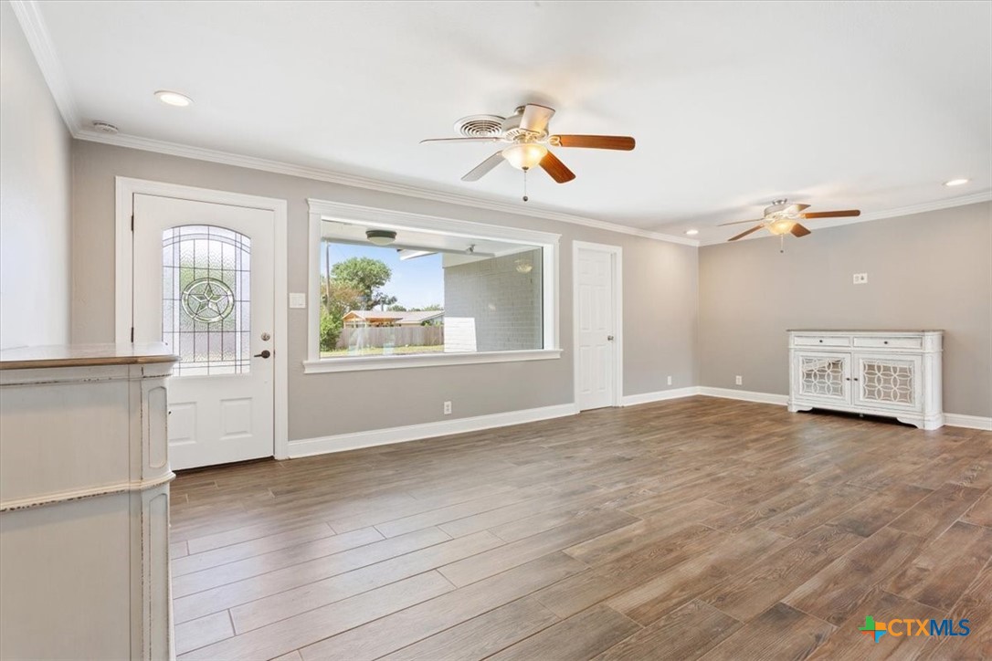 2810 Lilac Lane Temple, TX 76502 - Photo 5 of 40 a view of empty room with wooden floor and fan