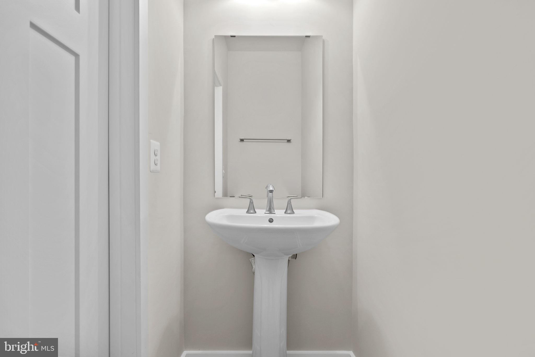 1523 Sumter Avenue Ranson, WV 25438 - Photo 45 of 50 a bathroom with a sink and a mirror