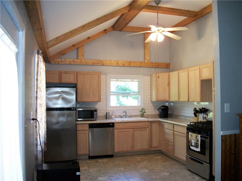 2094 Loucks Road Scottdale, PA 15683 - Photo 2 of 18 Cathedral ceilings with pine wood beams surround the newly updated kitchen with stainless steel appliances.
