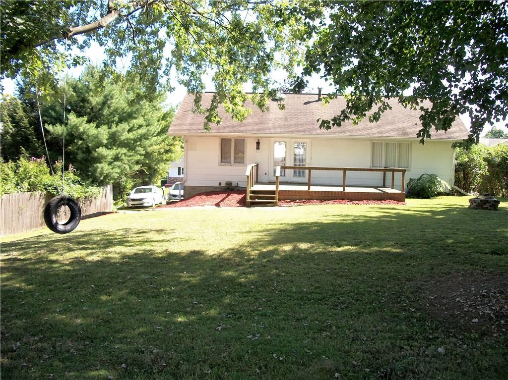 2094 Loucks Road Scottdale, PA 15683 - Photo 16 of 18 Inviting backyard with mature trees and rear deck