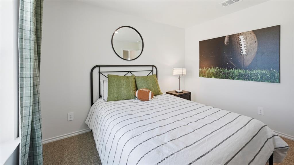 1957 Freeman Street Tyler, TX 75704 - Photo 21 of 25 Bedroom featuring neutral wall paint, textured carpeting, a visible window, and a ceiling vent