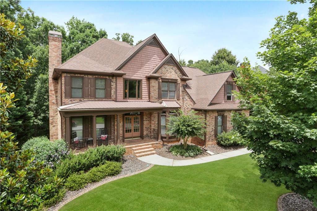 504 Huntington Place Canton, GA 30115 - Photo 1 of 1 Gorgeous Craftsman is nestled in the woods on the quietest cul-de-sac in Woodmont Golf & Country Club.