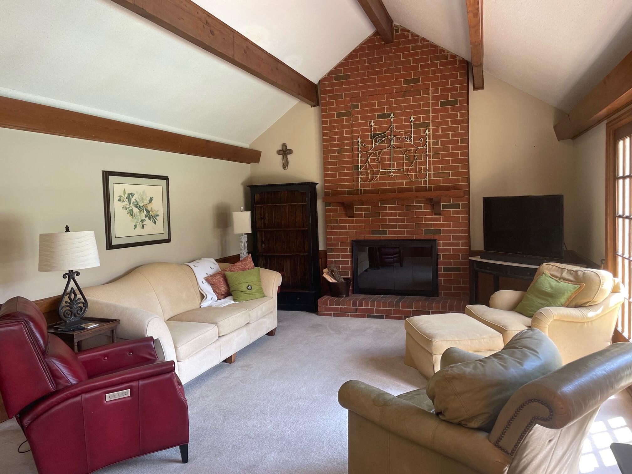 3344 Wheeler Road Augusta, GA 30909 - Photo 12 of 31 Family Room/Den with brick hearth wood-burning FP, vaulted ceiling with wood beam accents.