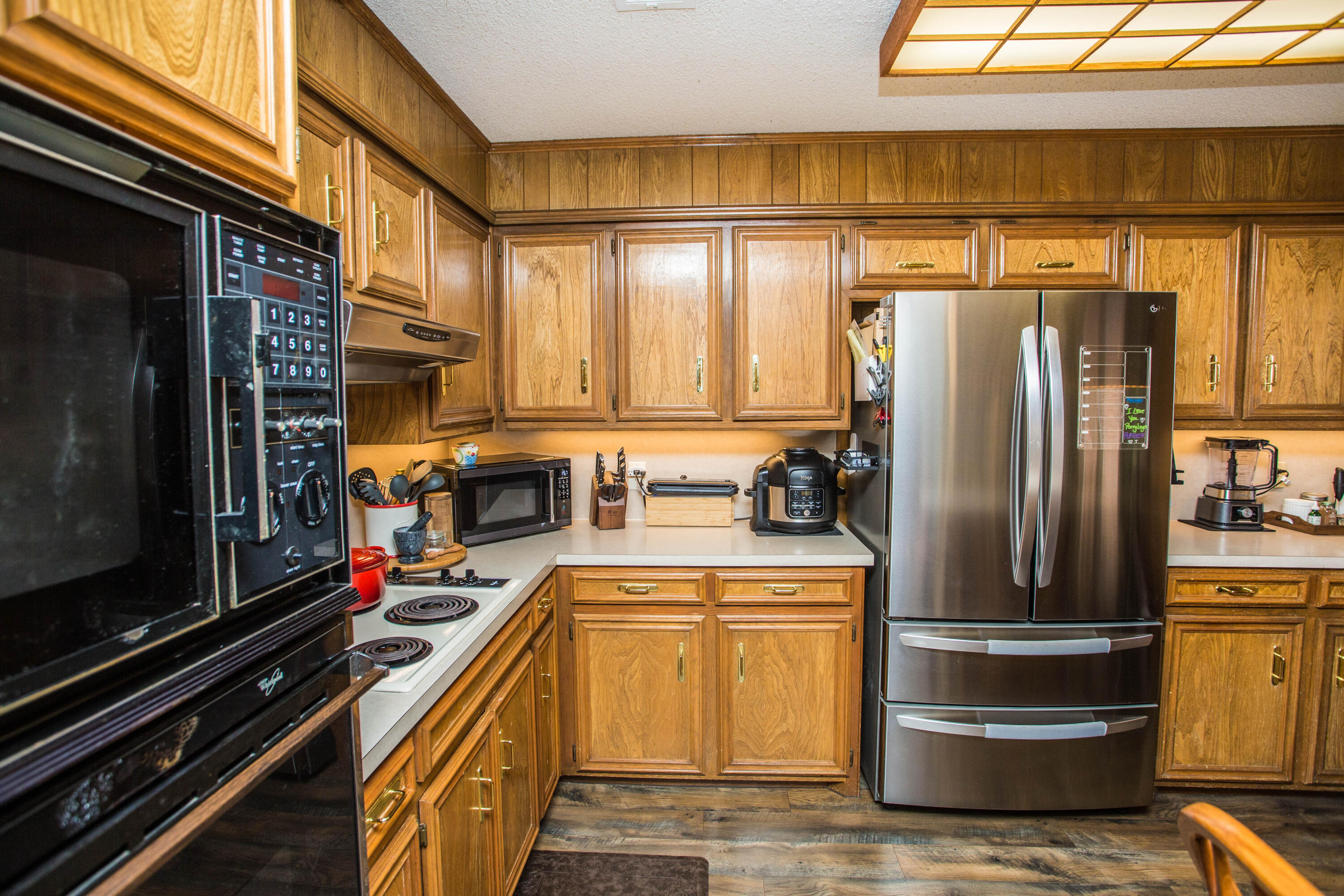 5202 85th Street Lubbock, TX 79424 - Photo 19 of 40 a kitchen with stainless steel appliances a refrigerator a stove and a sink