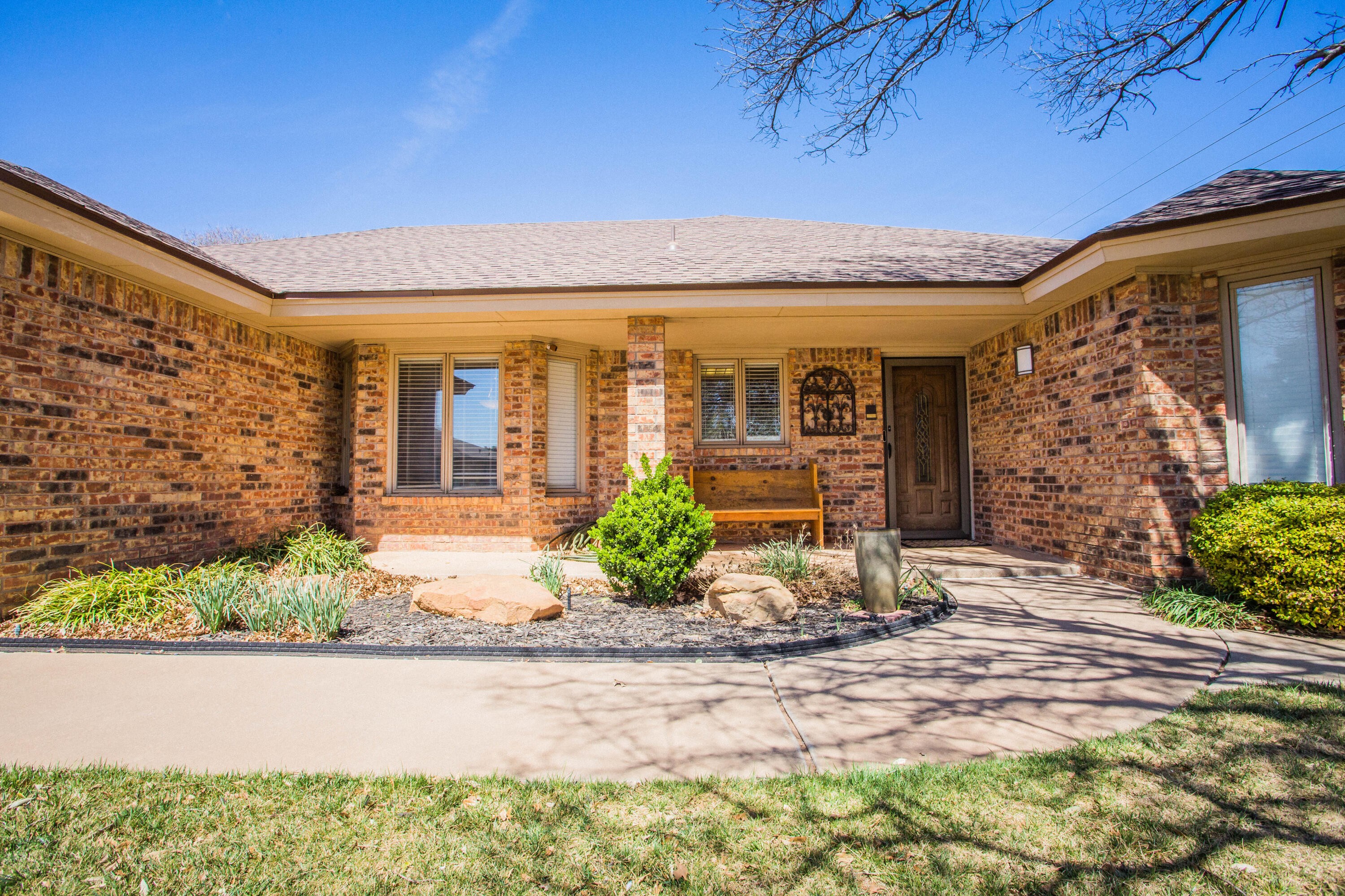 5202 85th Street Lubbock, TX 79424 - Photo 2 of 40 a front view of a house with garden