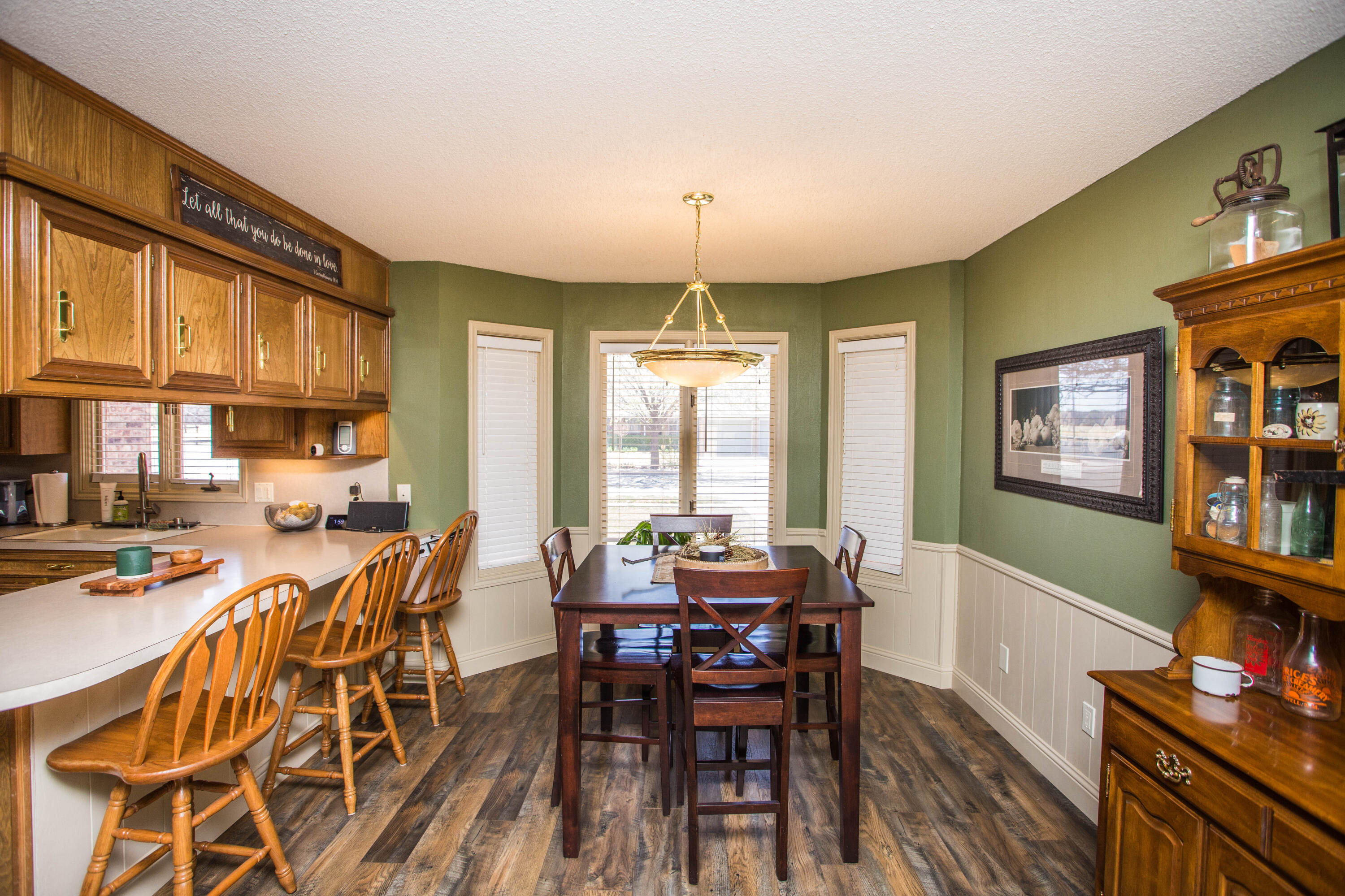 5202 85th Street Lubbock, TX 79424 - Photo 23 of 40 a view of a dining room with furniture window and wooden floor
