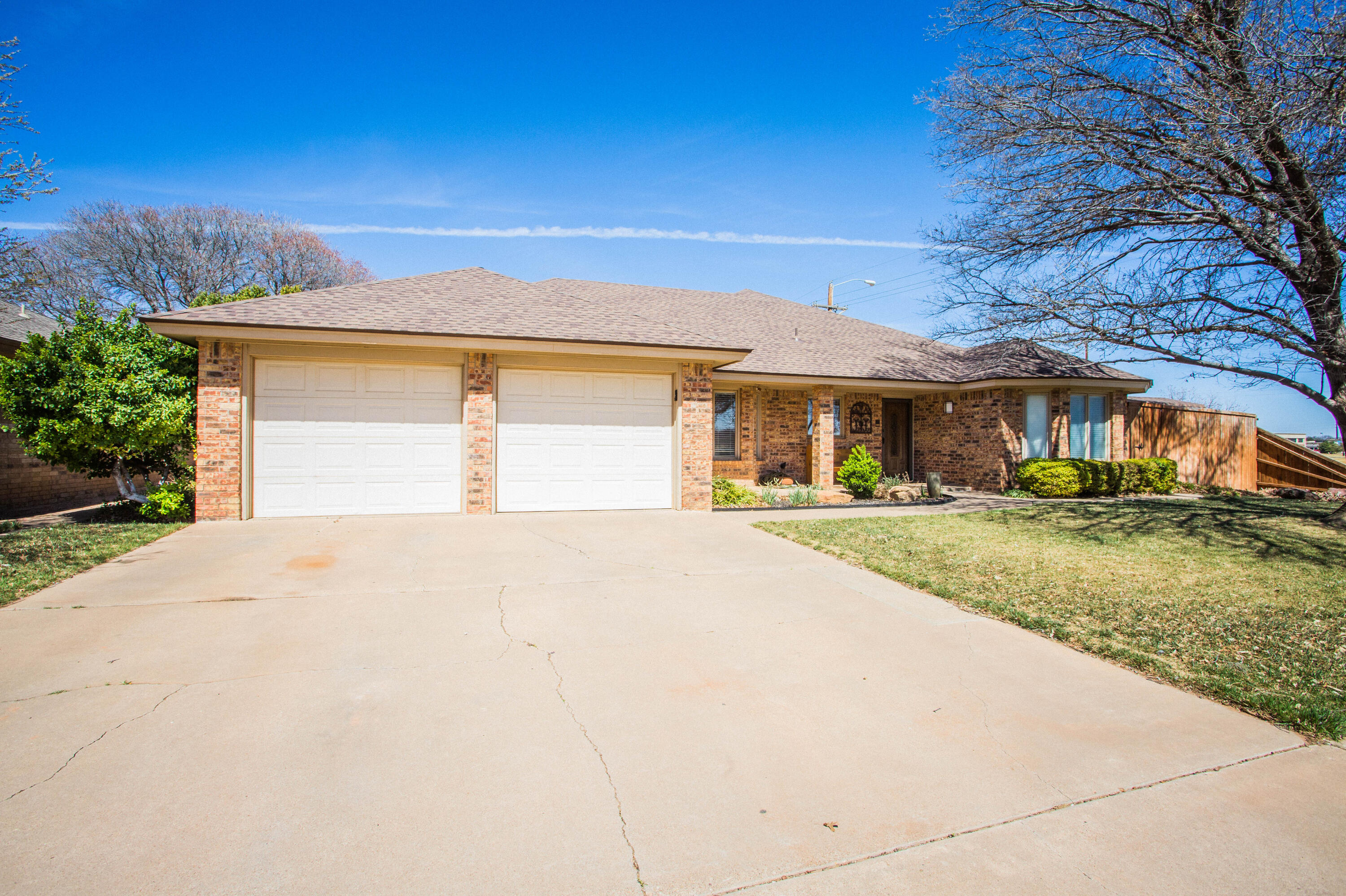 5202 85th Street Lubbock, TX 79424 - Photo 3 of 40 front view of house with a yard