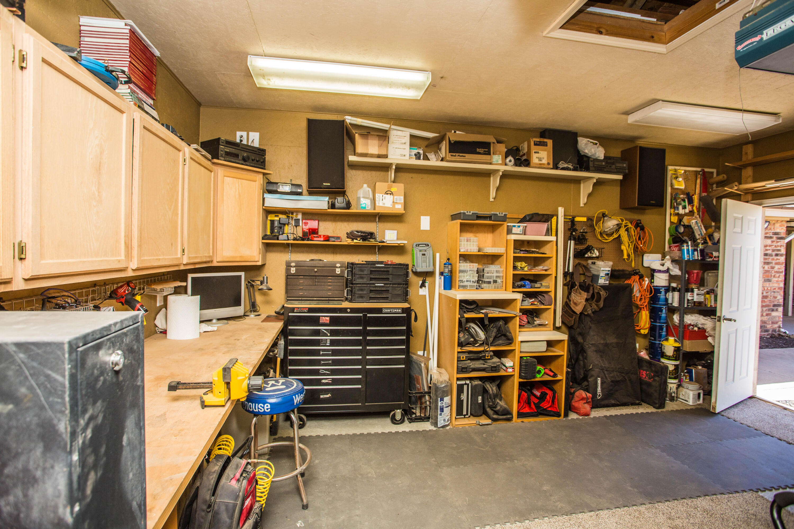 5202 85th Street Lubbock, TX 79424 - Photo 32 of 40 a view of walk in closet with clothes and shoes