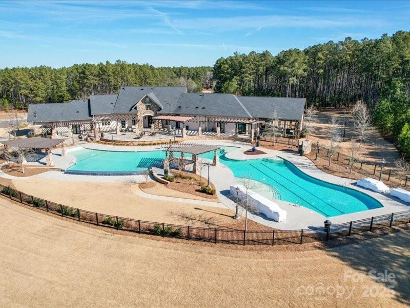8090 Gulf Crk Road, Unit 56 Lancaster, SC 29720 - Photo 6 of 35 an aerial view of a house with a garden and lake view