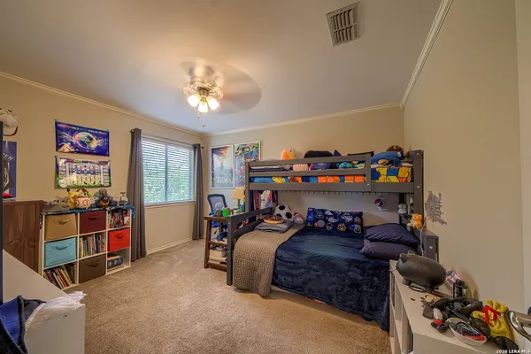 a bedroom with furniture and a window