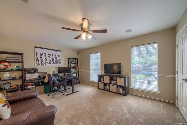 a view of a livingroom with furniture and a window