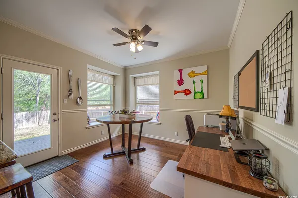 a view of a livingroom with furniture window and wooden floor