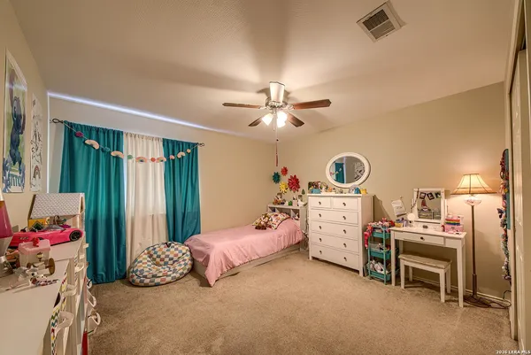 a bedroom with furniture and white walls