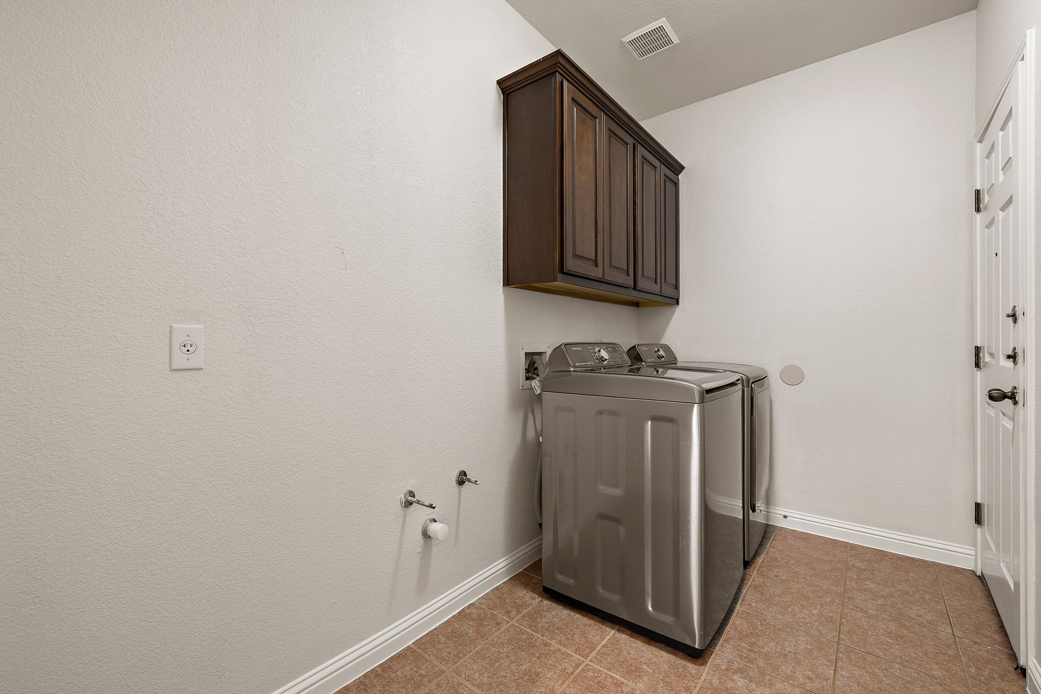 1115 Canyon Maple Road Pflugerville, TX 78660 - Photo 28 of 34 Laundry room plumbed for a fridge and a utility sink!