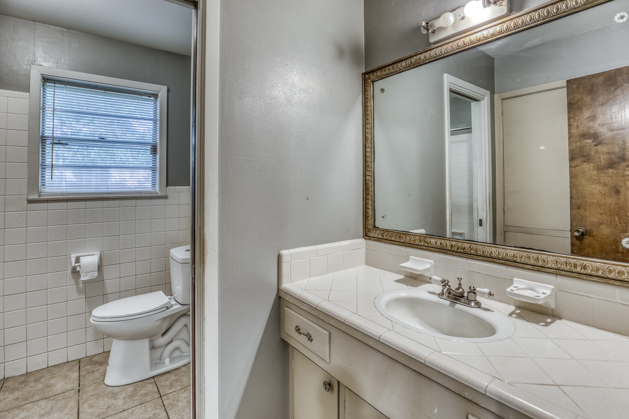 1687 Eagle Lake Road Sealy, TX 77474 - Photo 20 of 27 a bathroom with a sink and a toilet