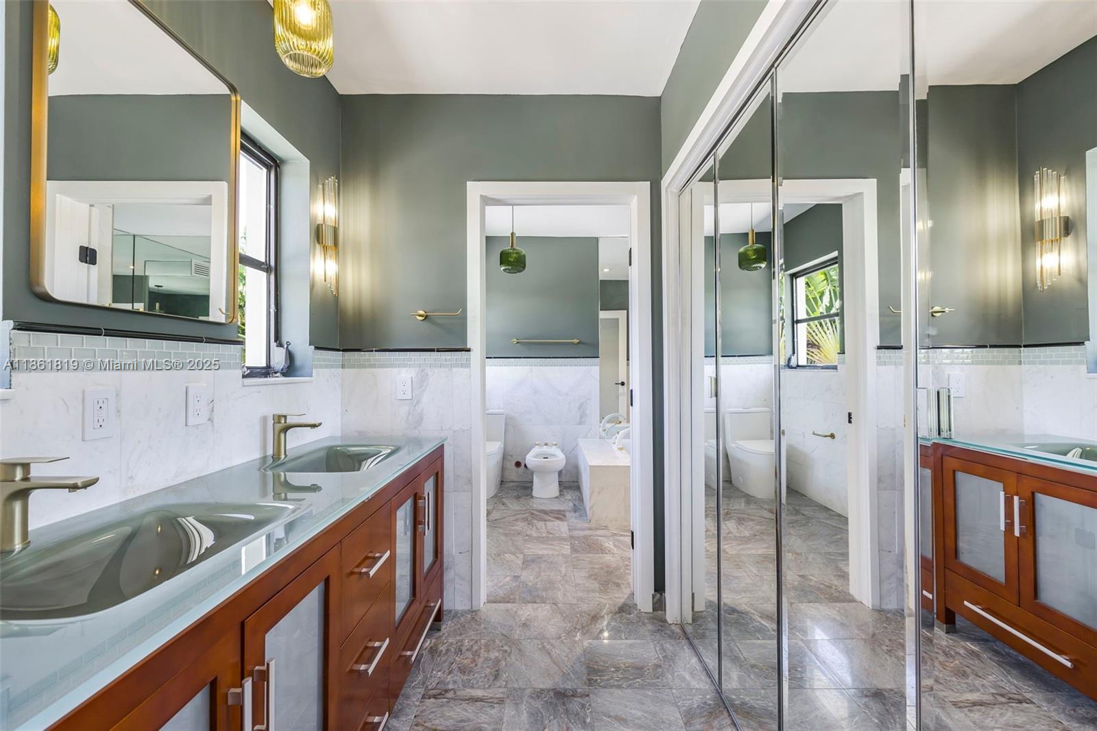 3180 North Bay Road Miami Beach, FL 33140 - Photo 26 of 41 a bathroom with a sink a toilet and shower