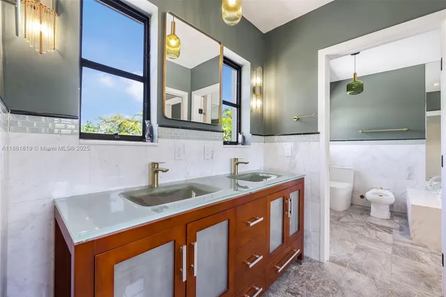 a view of a wooden deck and a yard