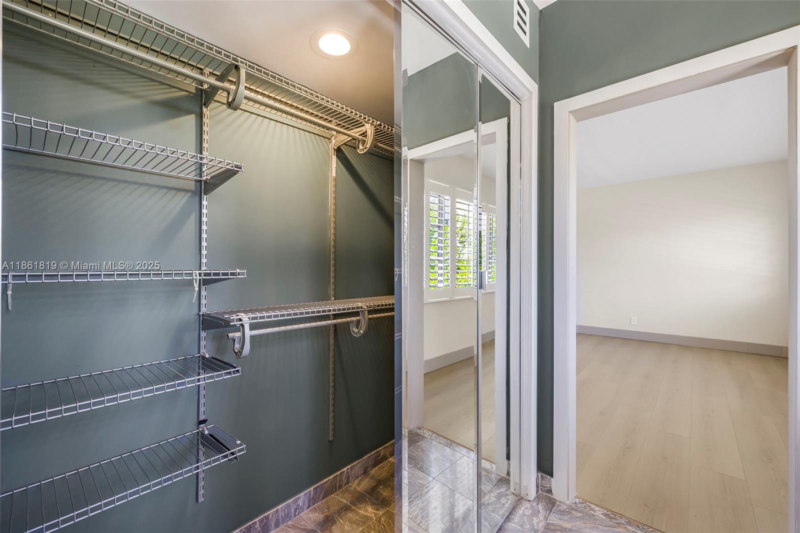 3180 North Bay Road Miami Beach, FL 33140 - Photo 28 of 41 a bathroom with a glass shower door