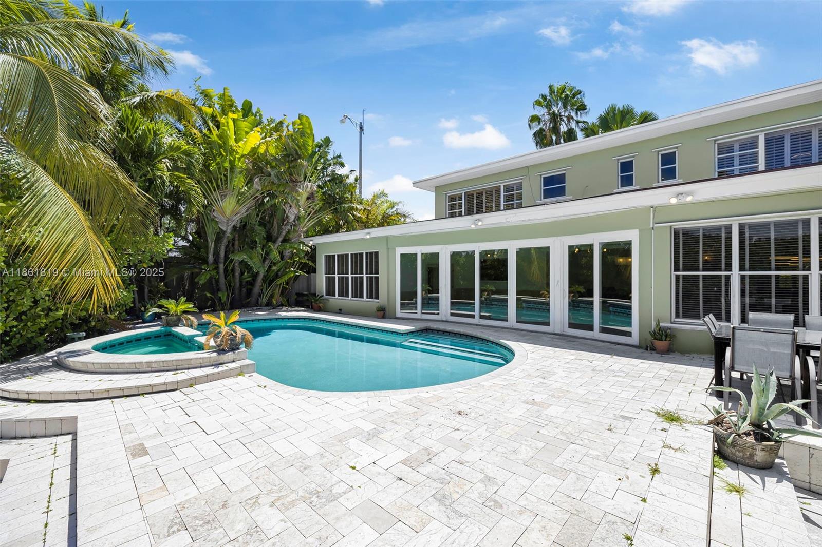 3180 North Bay Road Miami Beach, FL 33140 - Photo 33 of 41 a view of a house with backyard and sitting area
