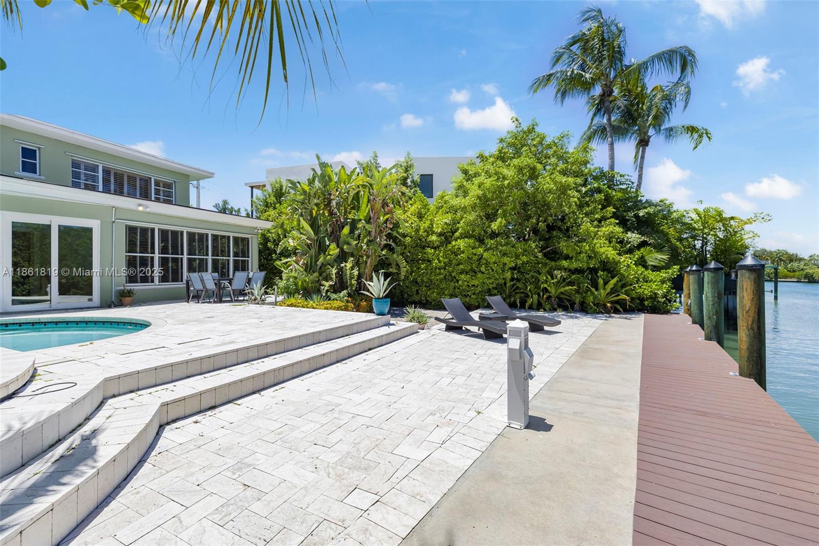 3180 North Bay Road Miami Beach, FL 33140 - Photo 36 of 41 a house view with a garden space