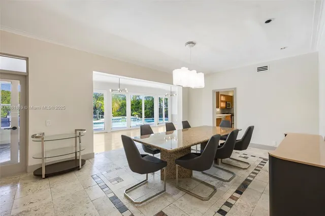 a large kitchen with a sink and refrigerator