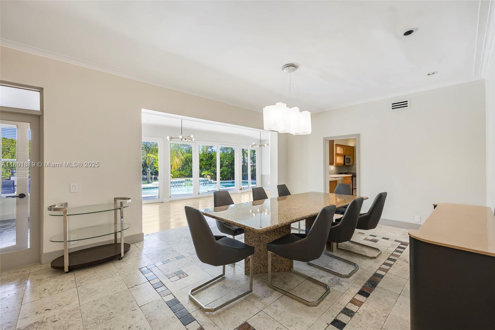 3180 North Bay Road Miami Beach, FL 33140 - Photo 9 of 41 a view of a dining room with furniture window and outside view