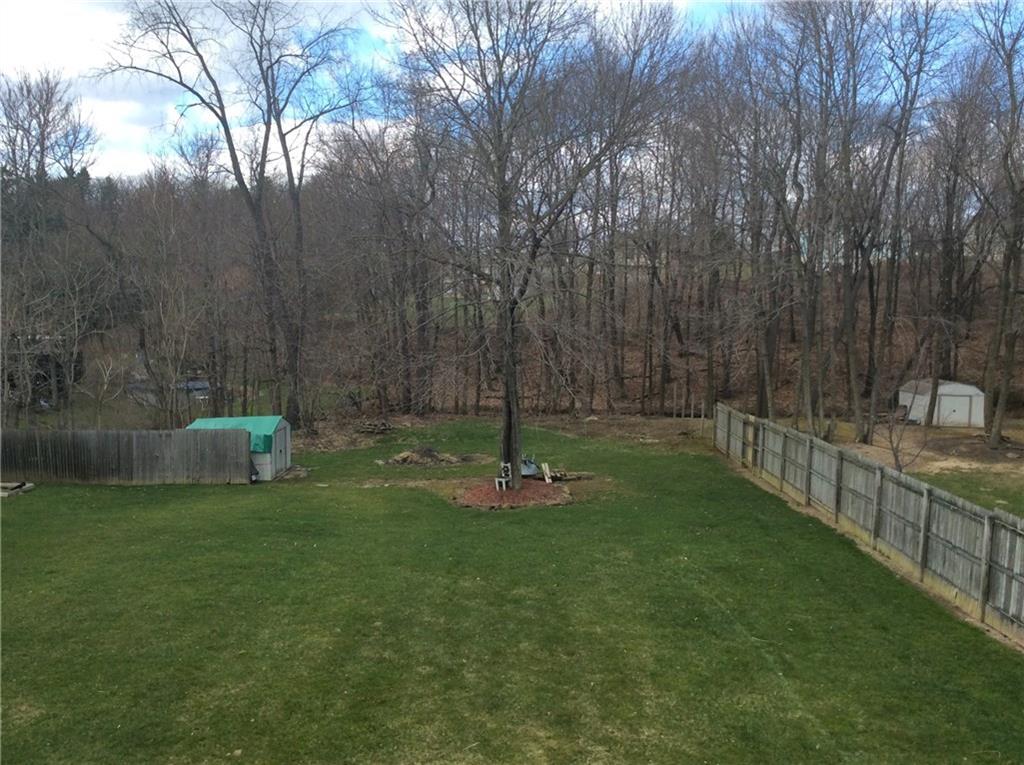 132 West McQuistion Road Butler, PA 16001 - Photo 17 of 20 SPACIOUS FENCED IN BACK YARD W/STORAGE SHED. PRIVATE, LINED WITH WOODED LOT.
