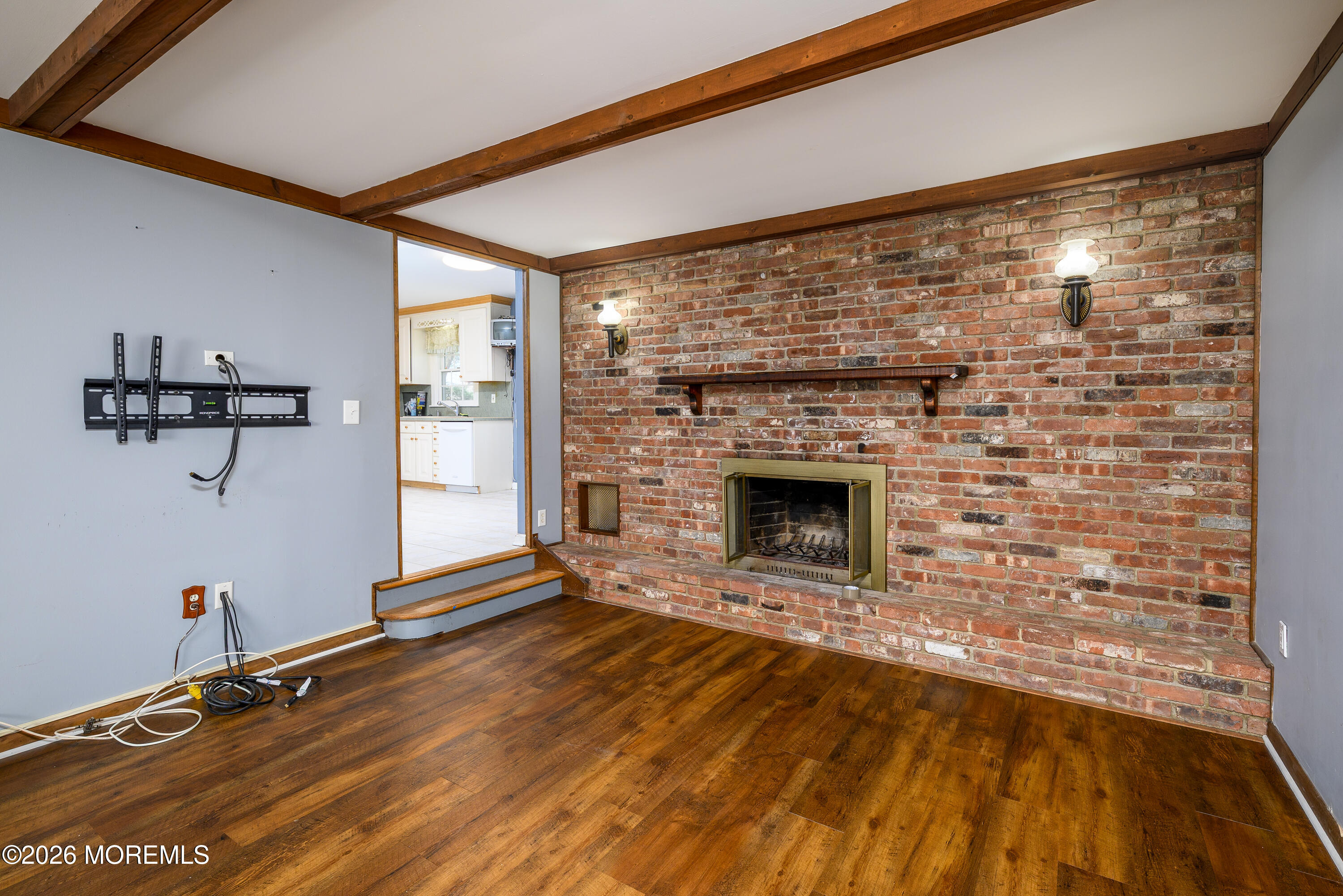 821 Middletown-Lincroft Road Middletown, NJ 07748 - Photo 13 of 42 a view of a room with wooden floor and a fireplace