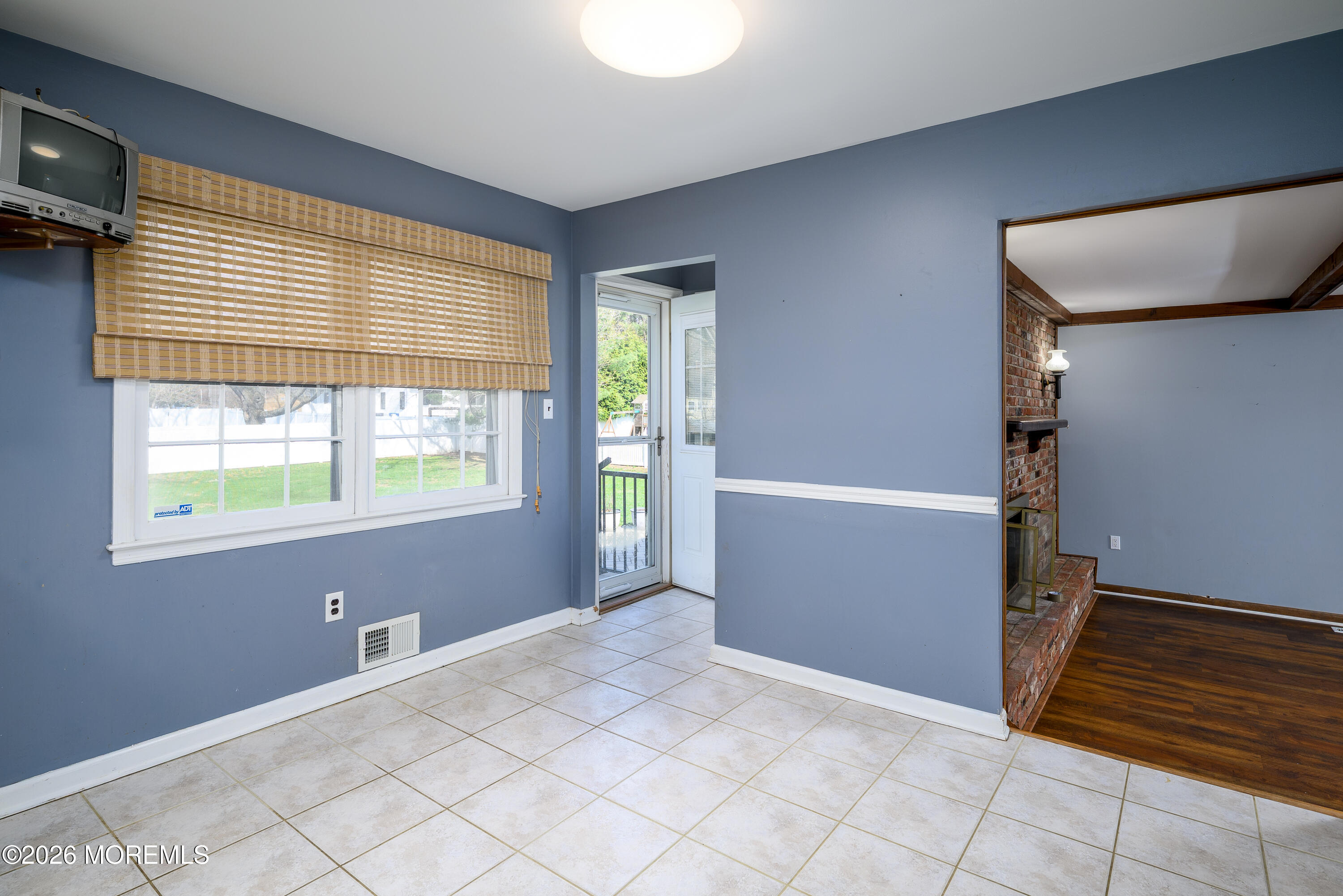 821 Middletown-Lincroft Road Middletown, NJ 07748 - Photo 16 of 42 a view of an empty room with window and cabinet