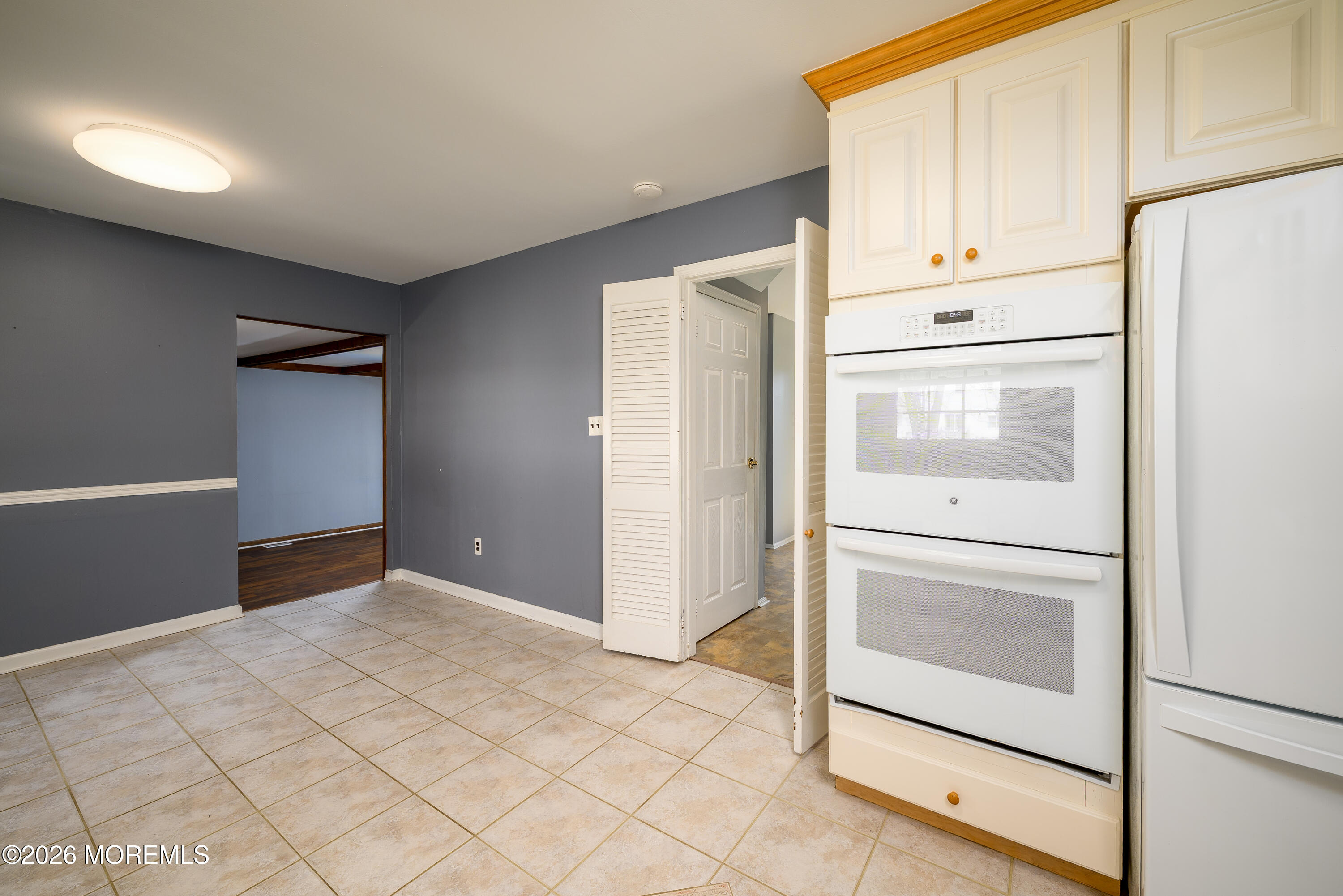 821 Middletown-Lincroft Road Middletown, NJ 07748 - Photo 17 of 42 a view of cabinets and refrigerator
