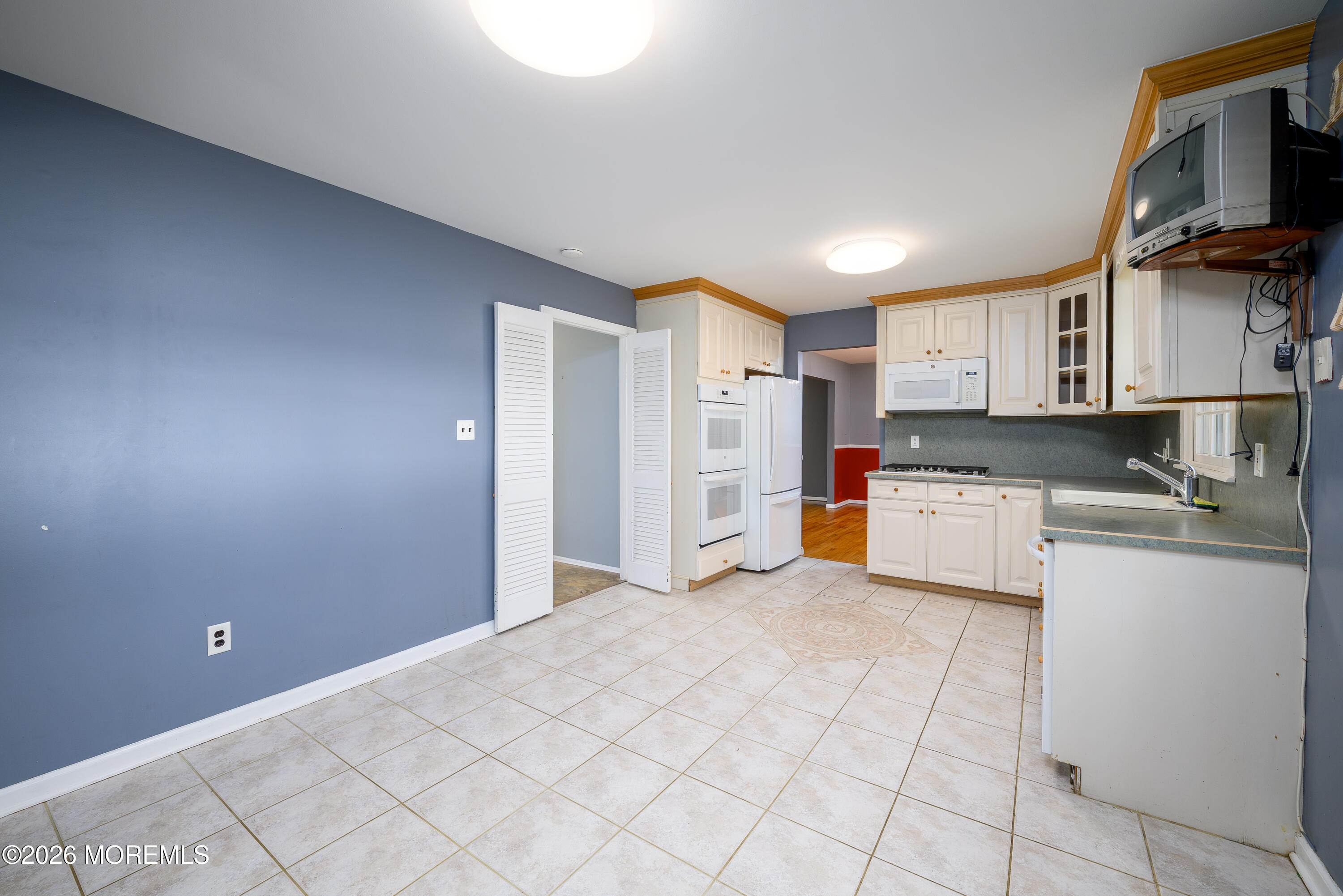 821 Middletown-Lincroft Road Middletown, NJ 07748 - Photo 18 of 42 a kitchen with stainless steel appliances a refrigerator and cabinets