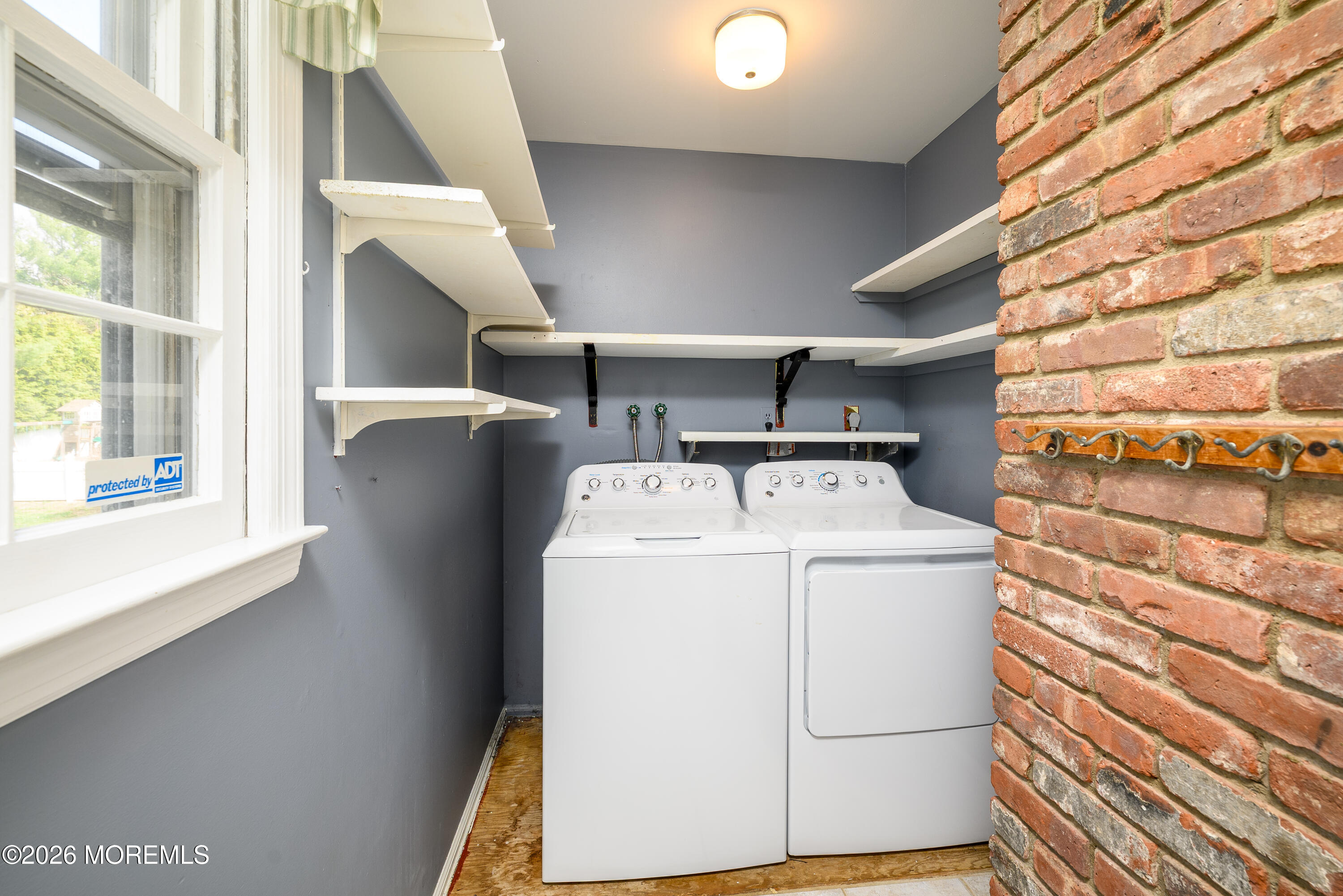 821 Middletown-Lincroft Road Middletown, NJ 07748 - Photo 19 of 42 a utility room with dryer and washer
