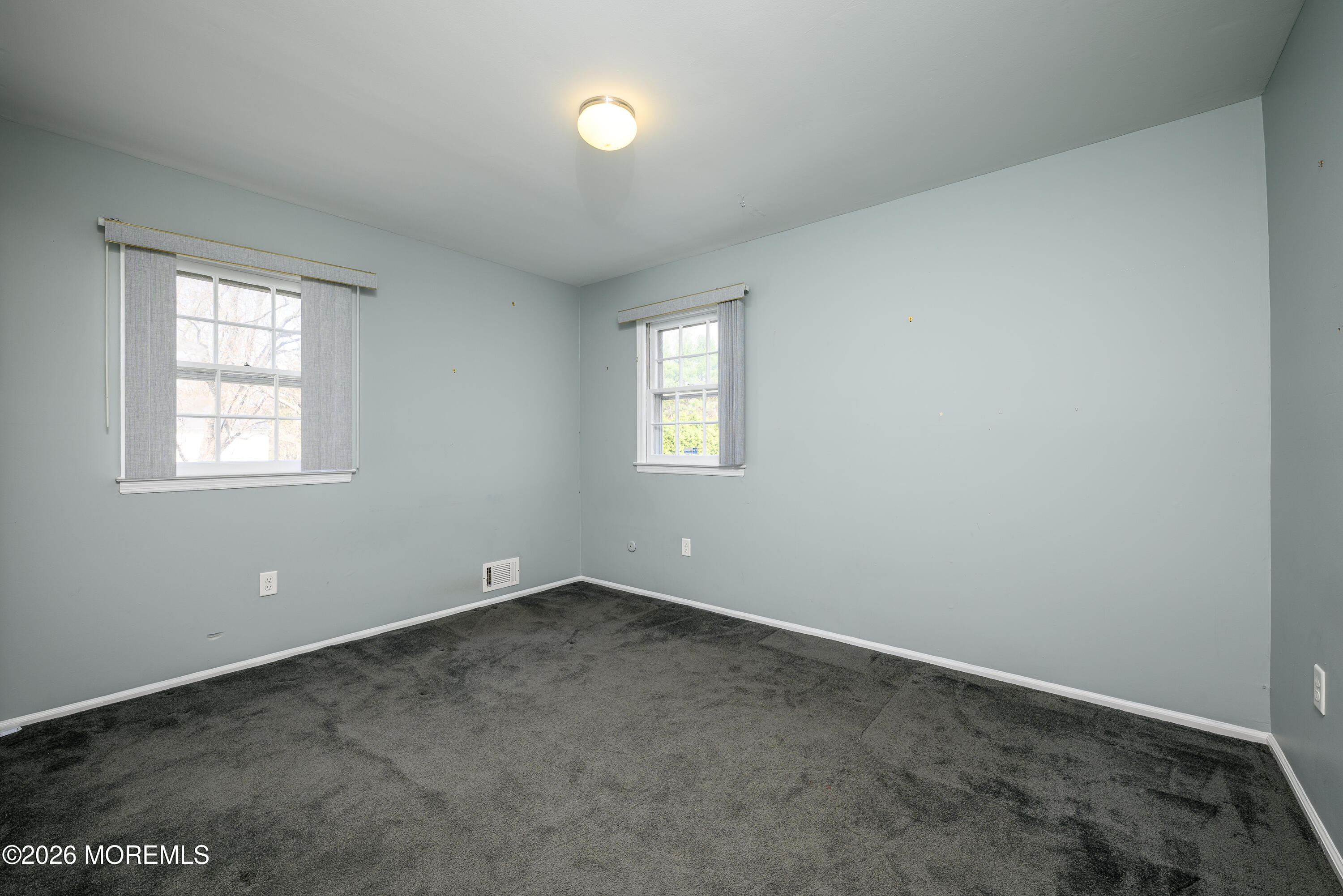 821 Middletown-Lincroft Road Middletown, NJ 07748 - Photo 28 of 42 an empty room with windows