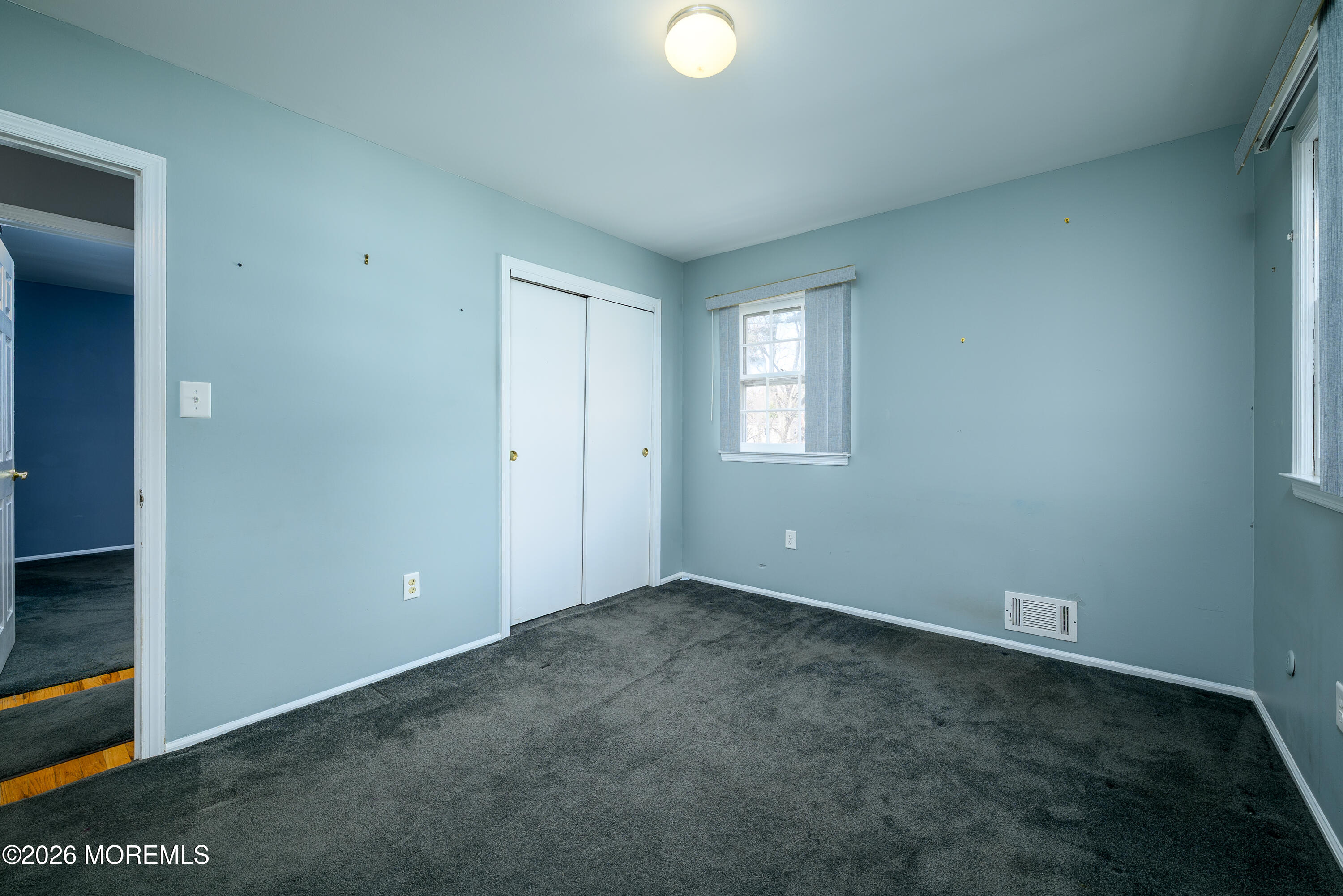 821 Middletown-Lincroft Road Middletown, NJ 07748 - Photo 29 of 42 an empty room with windows and closet