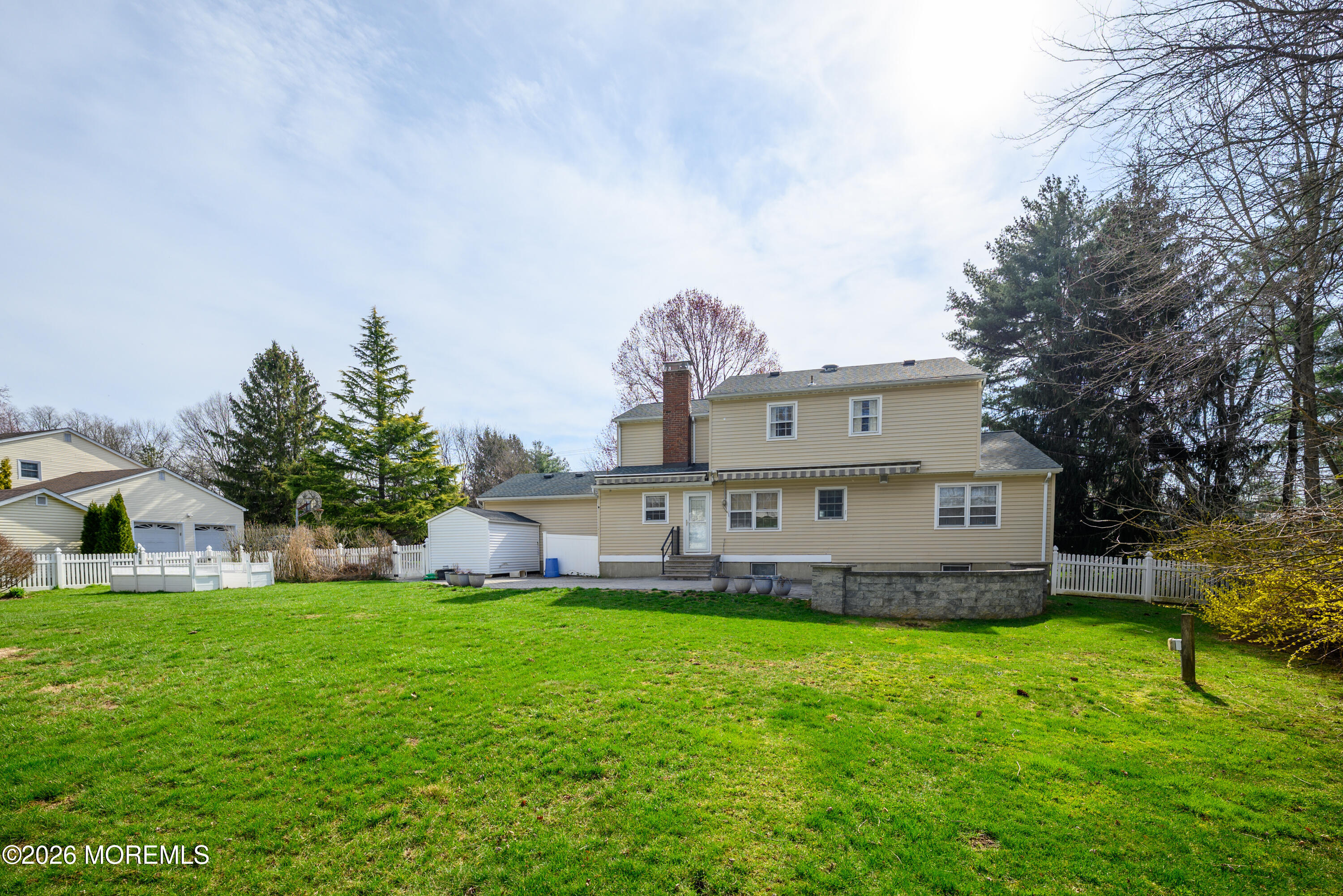821 Middletown-Lincroft Road Middletown, NJ 07748 - Photo 5 of 42 a view of a house with a big yard and large trees